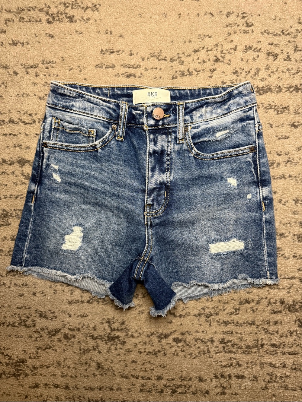 BKE Women’s Distressed Denim Shorts in Medium Blue